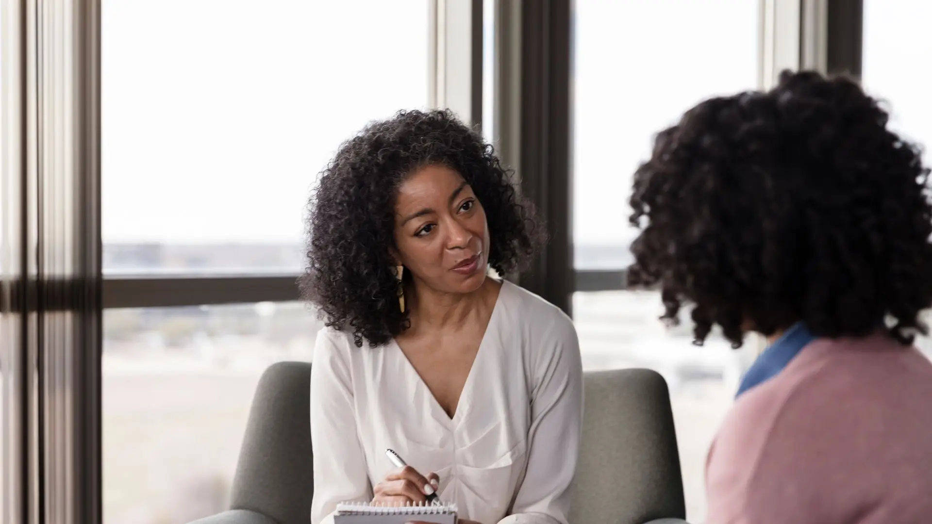 A therapist talking to a patient. 